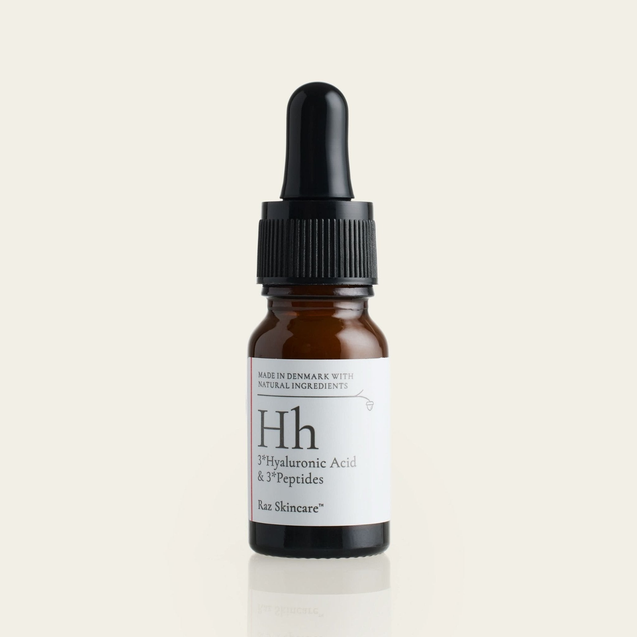 Hh 10ml - Raz Skincare - placeret foran en beige baggrund