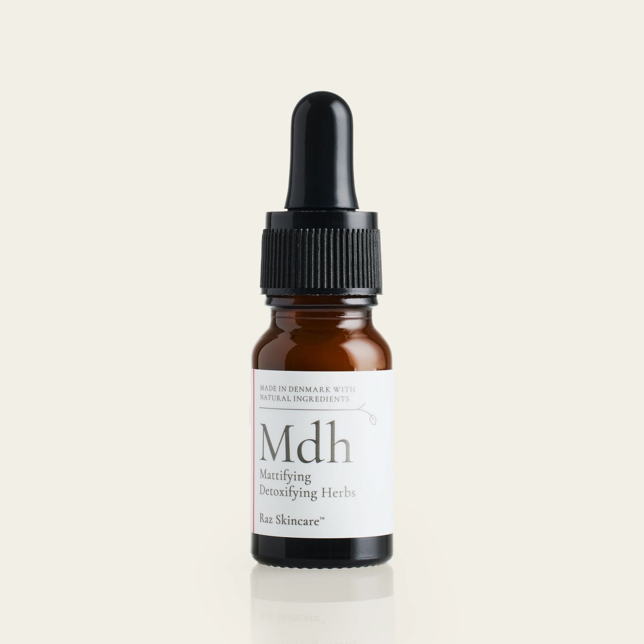 Mdh 10ml - Raz Skincare - placeret foran en beige baggrund