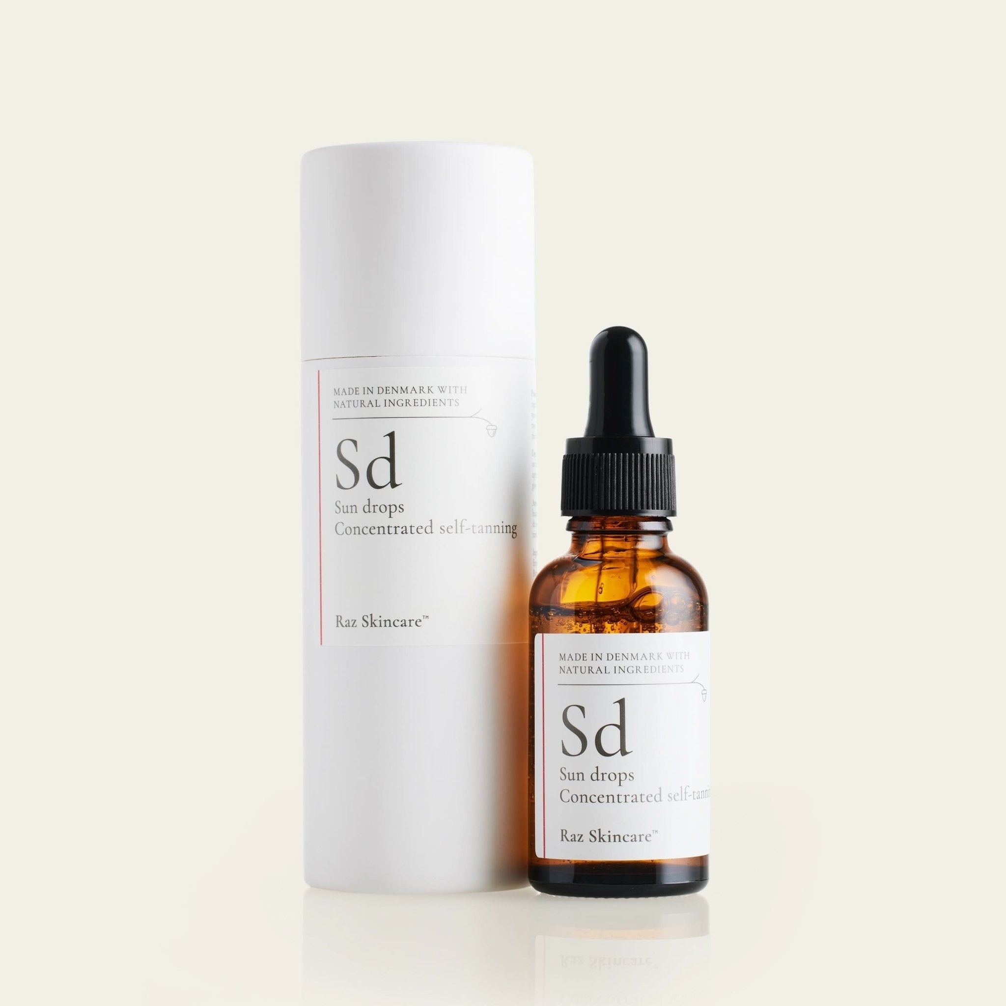 Sd Sun Drops 30ml - Raz Skincare - Sd flasken ved siden af dens emballage